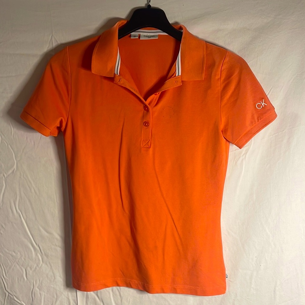 Small orange Calvin Klein short sleeve golf shirt